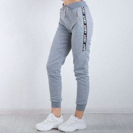 Szare spodnie dresowe z napisami - Spodnie