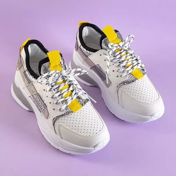 OUTLET Białe sportowe sneakersy damskie ze srebrnymi wstawkami Tadea - Obuwie