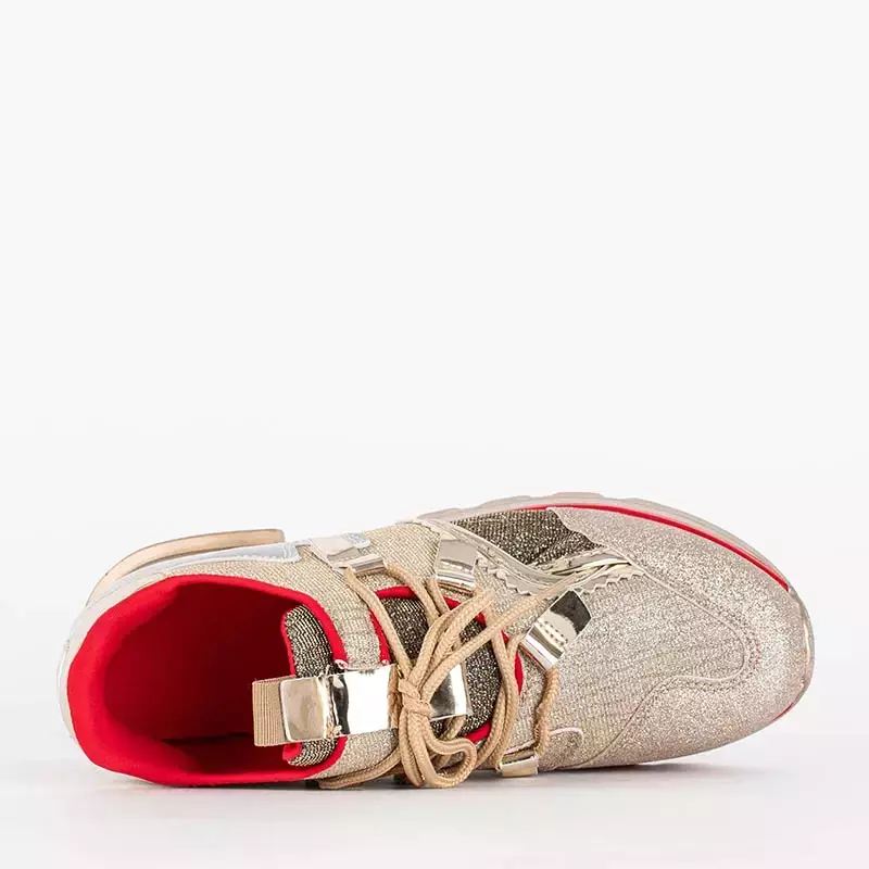 OUTLET Złote damskie sportowe buty w błyszczącym wydaniu Shinino - Obuwie