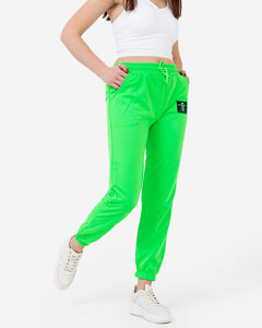 Неонові зелені жіночі спортивні штани