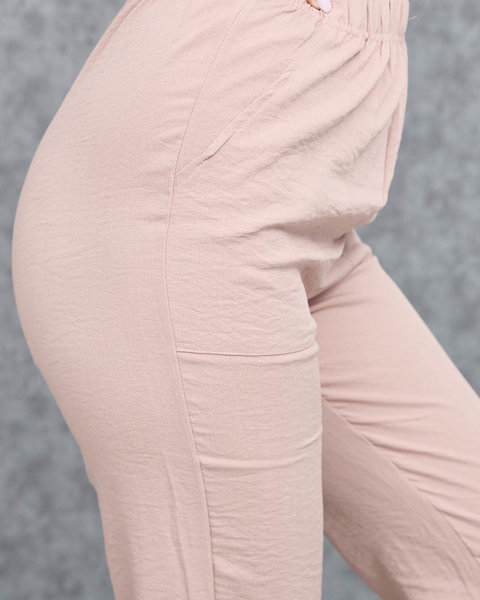 Жіночі штани з рожевої тканини - Одяг
